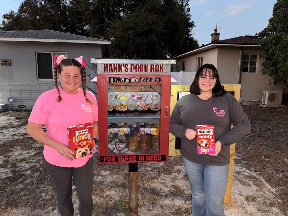 Stacey and Caylee Ward, the mother-daughter owners of St. Pete Shopping Company, standing together on a St. Petersburg boardwalk
